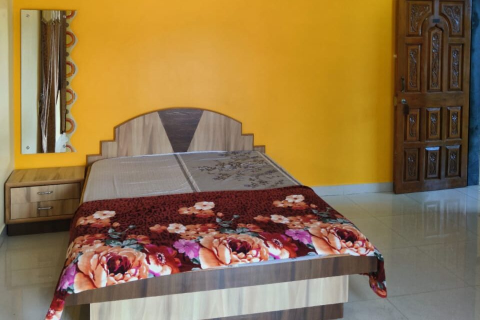 Swarn Palace Devgad lodging spacious room